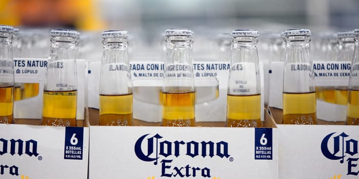 Corona Extra Beer sale, in beer boxes for 6 bottles, with handle. Pile of corona brand mexican beer boxes in a supermarket. Corona is the most popular imported beer in the USA. 20.02.2024, Armenia