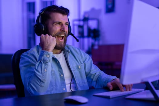 Gamer enthusiastically talking into mic at home
