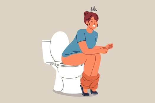 Woman poops sitting on toilet and suffers from constipation caused by indigestion or stomach