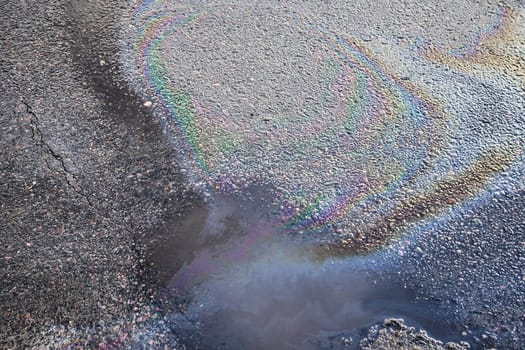 Oil stain on Asphalt, color Gasoline fuel spots on Asphalt Road as Texture or Background.