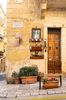 a religious icon on the wall in Valletta, Malta