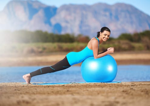 Woman, portrait and yoga ball or outdoor balance for stretching legs, pilates or mountain. Female person, fitness and outside for healthy core workout or lake physical activity, mobility or training