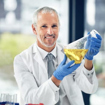 Mature man, liquid or portrait of scientist in lab for science innovation, vaccine or antiaging medicine. Life extension, medical or proud biologist with chemistry in research or beaker experiment