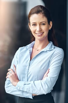 Crossed arms, happy and portrait of business woman in city for working, career and job. Professional worker, corporate lawyer and person with confidence, company pride and opportunity in morning
