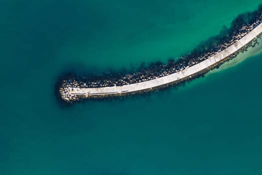 Aerial, nature and sea with footbridge in ocean, bay walk and coastal seaside or pedestrian pathway in summer. Outdoor, ecosystem for marine life and habitat for biology, top view in Mauritius