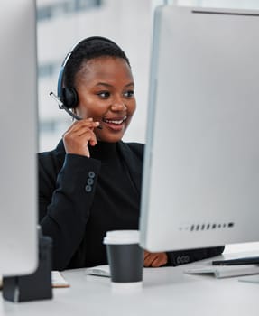 Call center, contact us and black woman consultant in office for online consultation with headset. Technology, technical support and female customer service or telemarketing agent work on computer.