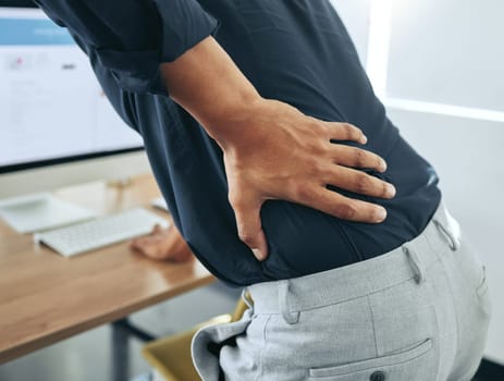 Hand, body or businessman with back pain injury, fatigue or burnout crisis in workplace, office or startup company. Spine posture, tired developer or injured web designer frustrated by muscle tension