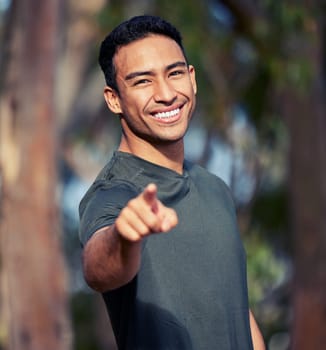 Man, portrait and pointing to you for fitness choice, outdoors and option or selection in nature. Male person, wellness and motivate for health or training, workout and exercise or emoji for cardio.