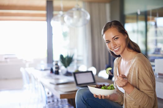 Woman, portrait and eating a salad in home, green vegetables and vegan diet for nutrition. Female person, healthy meal and organic food for detox or wellness, vitamin and minerals on freelancer break