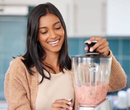 Woman, liquid in blender for smoothie and drink, detox and healthy shake for diet, weight loss and vegan. Fresh, organic and fruit cocktail in kitchen at home for nutrition, vitamins and smile