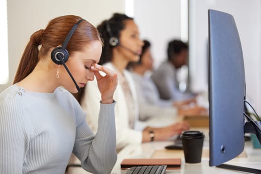 Stress, tired and woman in call center with headache, pain or burnout for customer service mistake. Fatigue, telemarketing and frustrated sales consultant with challenge, debt or fail on computer