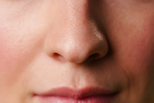 Close-Up photo of a Womans Lips and Nose With a Neutral Expression