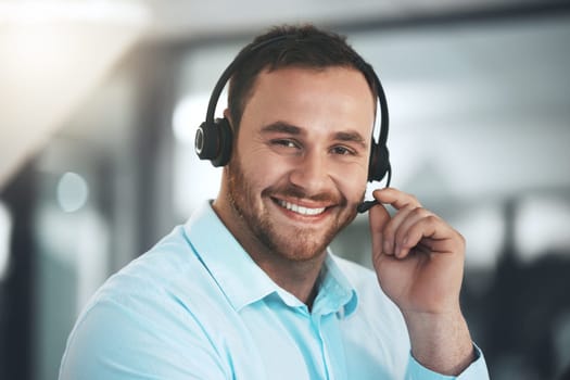 Man, portrait and headset at call centre for customer support or telemarketing sales, consultant or help desk. Male person, face and happy employee or tech advice for contact us, advisor or service