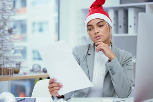 Christmas hat, business and woman with paperwork, doubt and reading with burnout, upset and confused. Person, employee and consultant working on Xmas day and document for festive season schedule