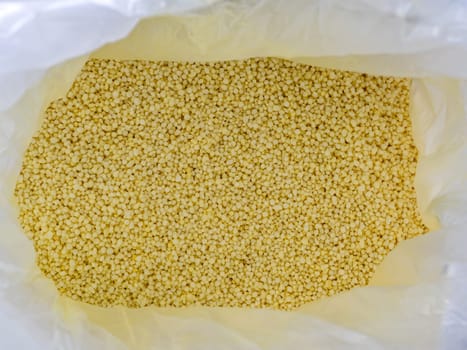 Light yellow small round granules are chemical fertilizers, calcium nitrate