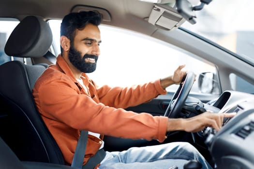 Indian Man Pushing Button Turning On Music Enjoying Automobile Journey