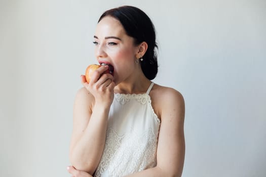 woman bites ripe apple healthy nutrition food vitamins