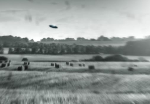 Alien, spaceship and UFO on farm, nature or sky with fantasy or science fiction event in countryside, field or landscape. Earth, aliens and extraterrestrial drone in environment with blur or motion