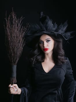 Charming halloween witch with broom