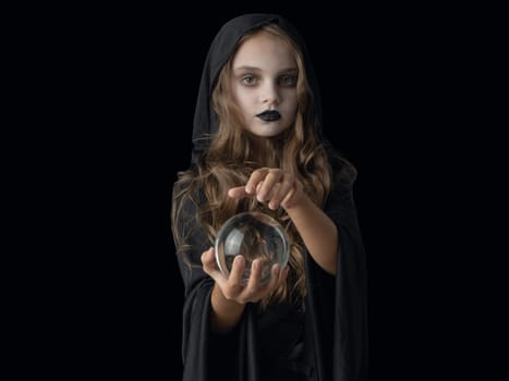 Halloween witch girl with crystal ball