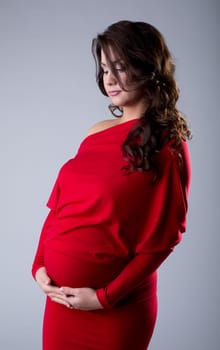 Studio shot of elegant pregnant woman