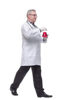 Doctor, the man shows an liquid. Consept of medic, beaker, biology, chemistry, control, workwear. Isolate on a white background