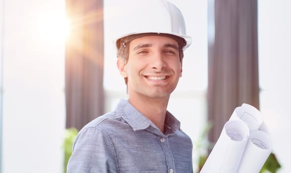 Portrait of an engineer in a hard hat posing for the camera