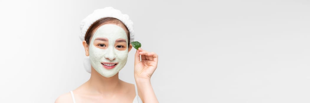Banner with young woman with clay face mask - natural spa, beauty from nature concept