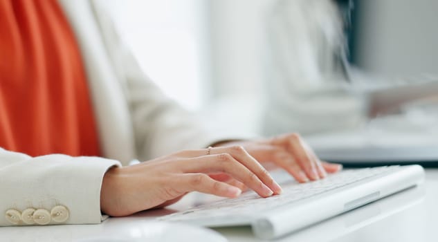 Consultant, typing and hands on keyboard in office with employee, communication and planning schedule in workplace. Business, writing or woman at desk with report, research and feedback on computer.