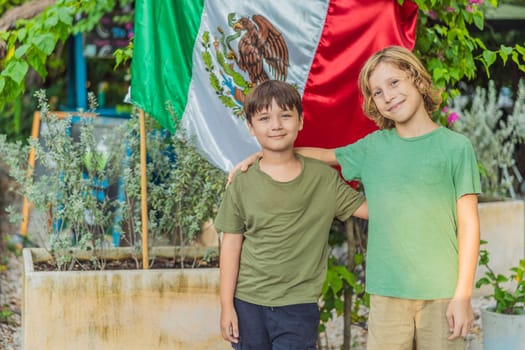 Immigrant boys in Mexico in front of the Mexican flag. New Mexicans