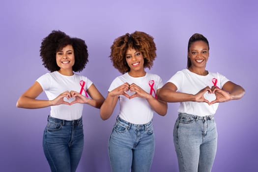 Black Ladies With Breast Cancer Ribbons Gesturing Heart Shape, Studio