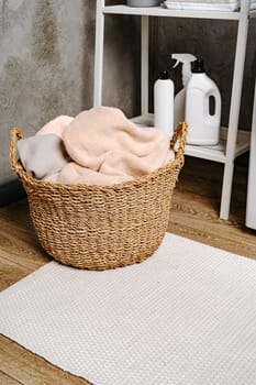 Laundry basket with dirty towels in a bathroom