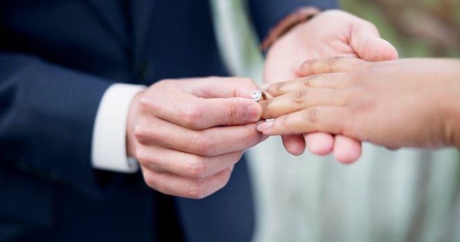 Couple, hands and ring for marriage, commitment or wedding in ceremony, love or support together. Closeup of people getting married, vows or accessory for symbol of bond, relationship or partnership