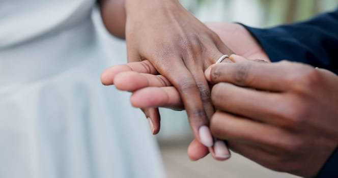 Couple, holding hands and ring for marriage, love or wedding in ceremony, commitment or support. Closeup of people getting married, vows or accessory for symbol of bond, relationship or partnership