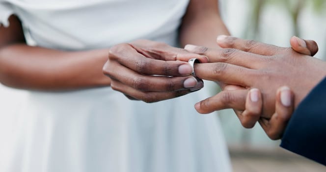 Couple, holding hands and ring for marriage, commitment or wedding in ceremony, love or support. Closeup of people getting married, vows or accessory for symbol of bond, relationship or partnership