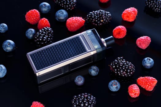 Vape smoking tool on black background with berries