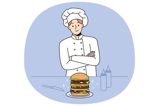 Chef cook burger in restaurant