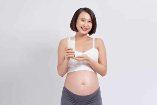 Photo of Asian pregnant woman on background