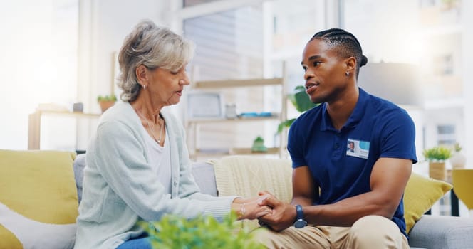 Black man, caregiver or old woman holding hands for support or empathy in cancer rehabilitation. Medical healthcare advice, senior person or male nurse nursing, talking or helping elderly patient