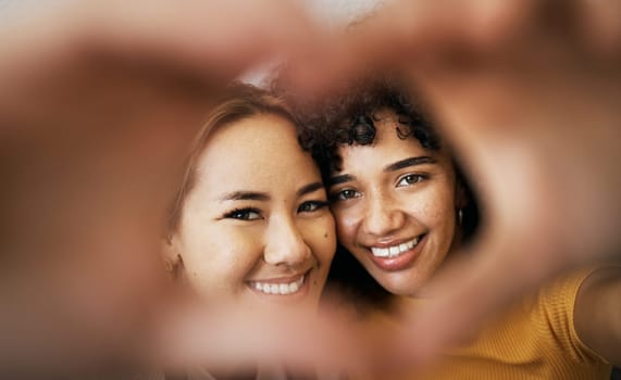 Lesbian couple, smile and heart with hands, portrait and closeup for romance, bonding and love and support for relationship. Happy people, together and solidarity for pride, lgbtq and hope for peace