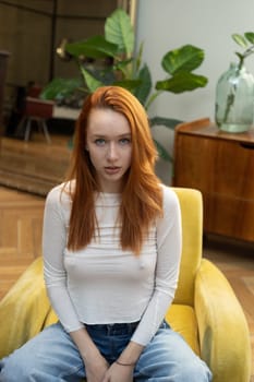 portrait of a young beautiful woman with red hair in  studio