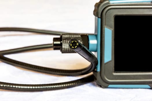 Endoscope camera on the table. Flexible inspection camera