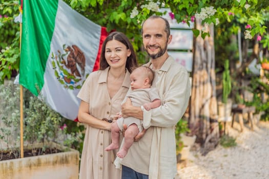 Immigrant family in front of the Mexican flag. New Mexicans. Childbirth in Mexico