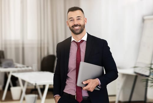Happy confident caucasian mature businessman in suit hold laptop, recommend study