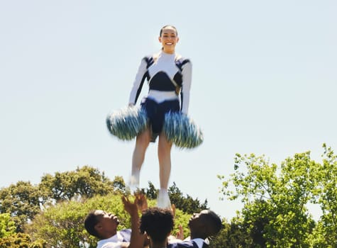 Fitness, portrait and woman cheerleader on a field for motivation or support practice with team. Sports, cheerleading and female athlete training for skill and dance with blur motion at competition.
