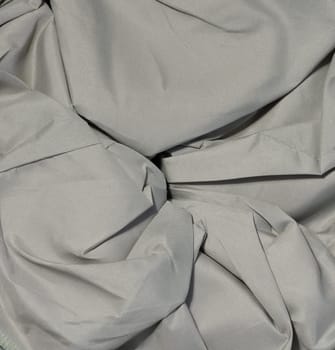 Crumpled gray fabric with creases