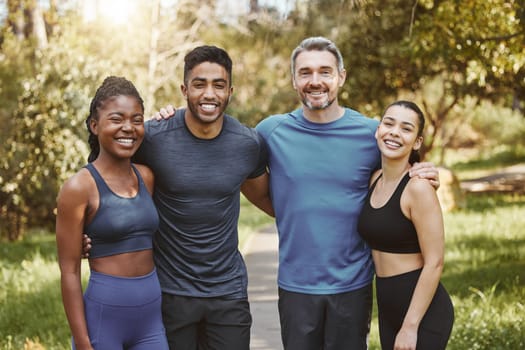 Fitness, group and people hug for portrait, athlete team and support for sport and health. Exercise friends, diversity and healthy with challenge, training together with workout and trust in forest