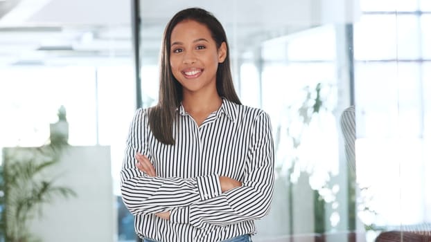 Business woman, arms crossed and portrait in office with a corporate professional with confidence. Happy, smile and lawyer with job pride of attorney work at law firm with employee at a company