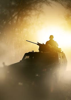 War, explosion and military tank with soldier silhouette on battlefield in conflict and politics. Orange light, fire and smoke from fight, person in armed forces and warzone with army warrior outdoor