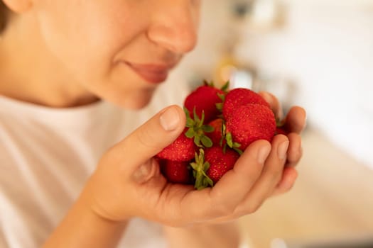 A close-up of fresh farm strawberries in hand